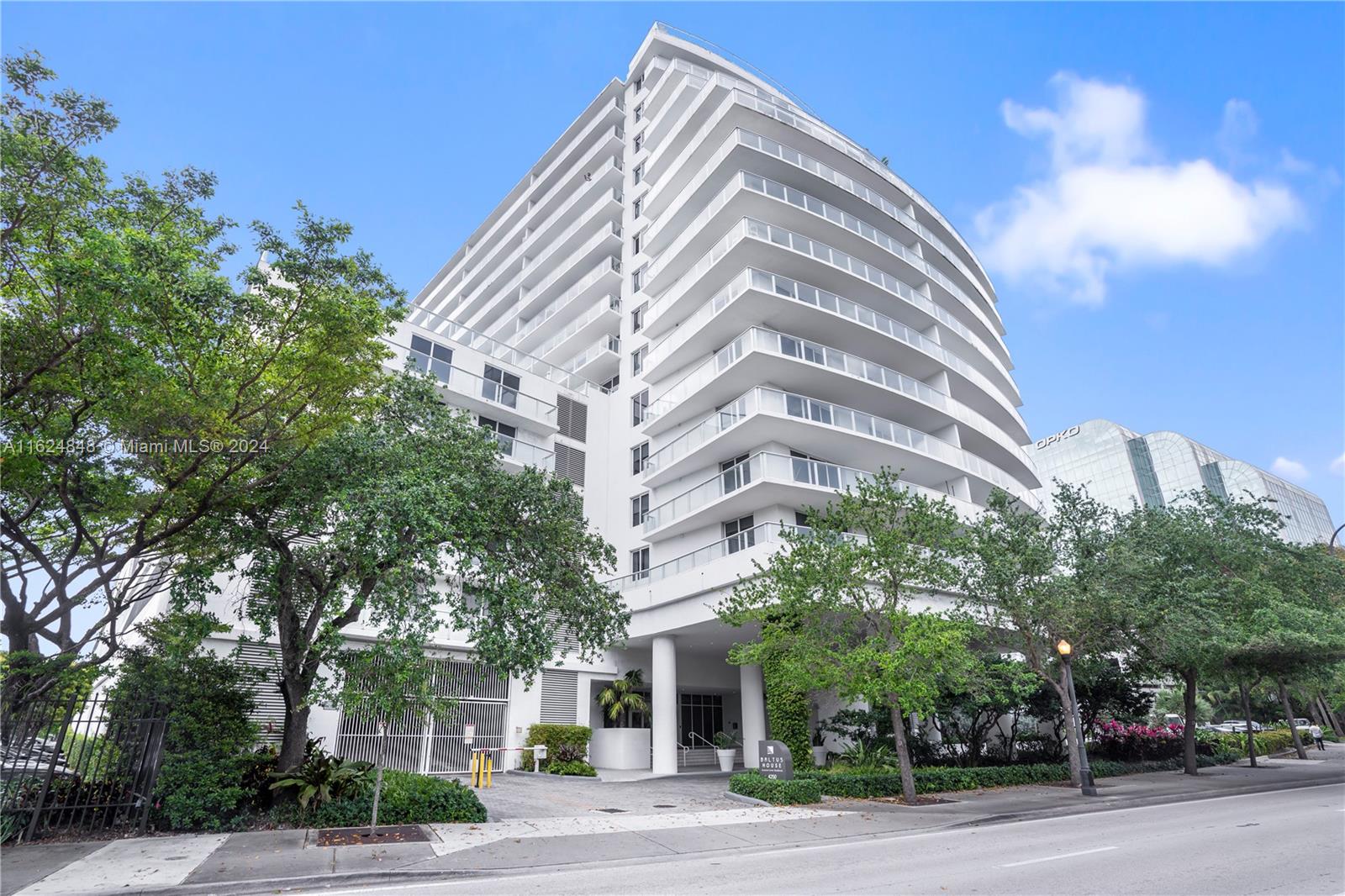 4250 Biscayne Boulevard, Unit 1018 Miami, FL 33137 - Photo 30 of 54 a view of a tall building next to a road
