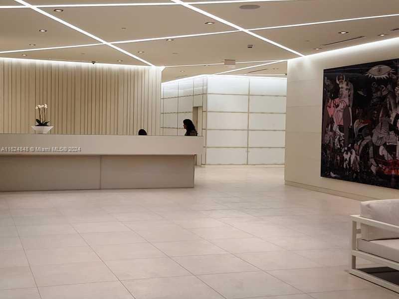 4250 Biscayne Boulevard, Unit 1018 Miami, FL 33137 - Photo 31 of 54 a view of a garage with rack and white walls