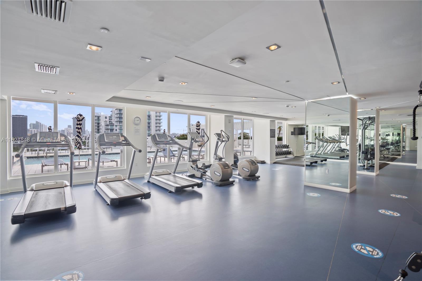 4250 Biscayne Boulevard, Unit 1018 Miami, FL 33137 - Photo 32 of 54 a view of a gym area with lots of gym equipment
