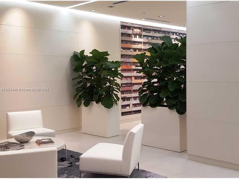 4250 Biscayne Boulevard, Unit 1018 Miami, FL 33137 - Photo 35 of 54 a vase of flowers sitting on a table