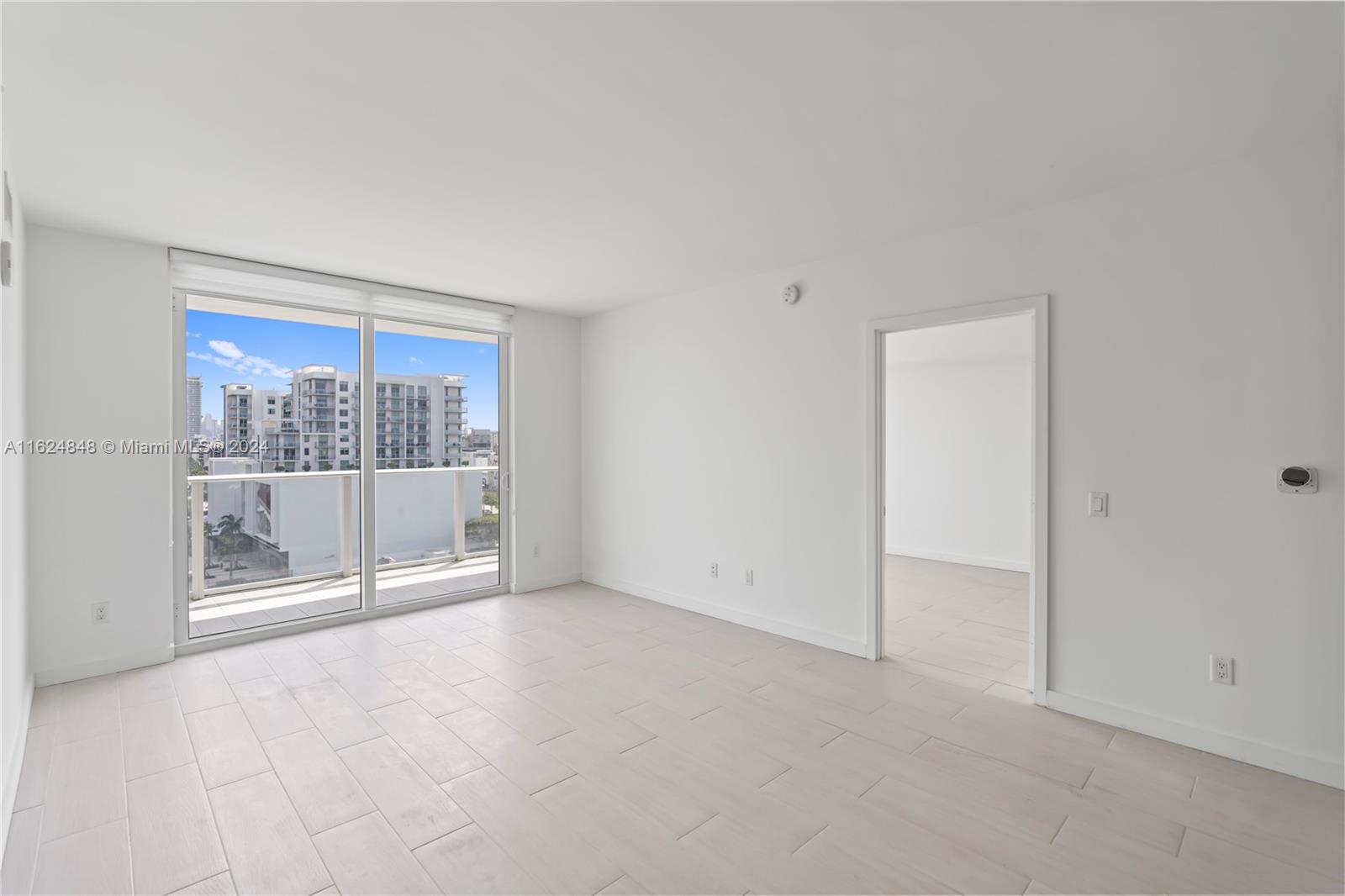 4250 Biscayne Boulevard, Unit 1018 Miami, FL 33137 - Photo 51 of 54 a view of an empty room with a window