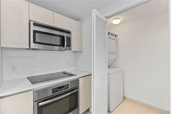 a kitchen with a stove and a microwave