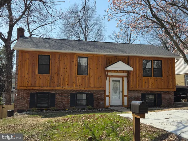 a front view of a house with yard