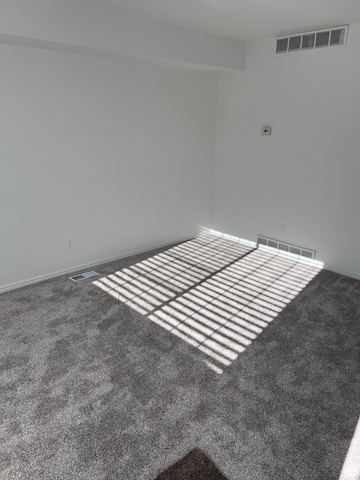 556 North Fairfield Road, Unit D4 Layton, UT 84041 - Photo 22 of 23 Unfurnished room with carpet flooring and baseboards