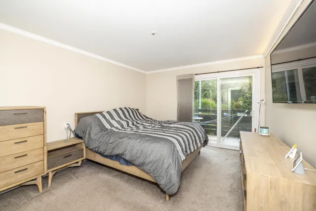 a bedroom with a bed and walk in closet