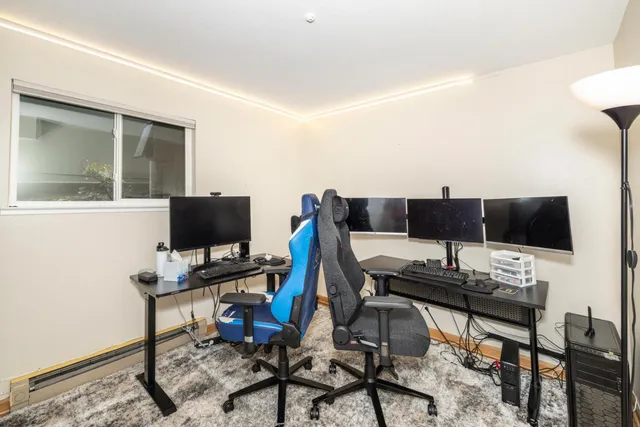 a view of a workspace with furniture