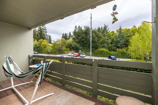 a view of a chairs and table in patio