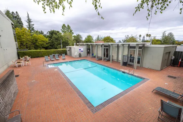 a view of swimming pool with seating area