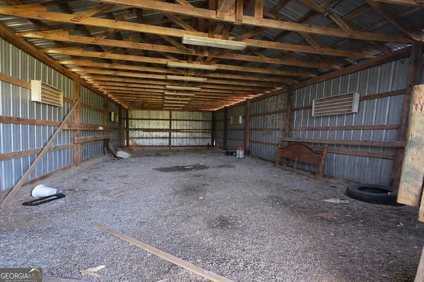 a view of an empty room with wooden walls
