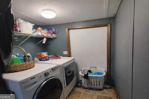 a storage room with washer and dryer