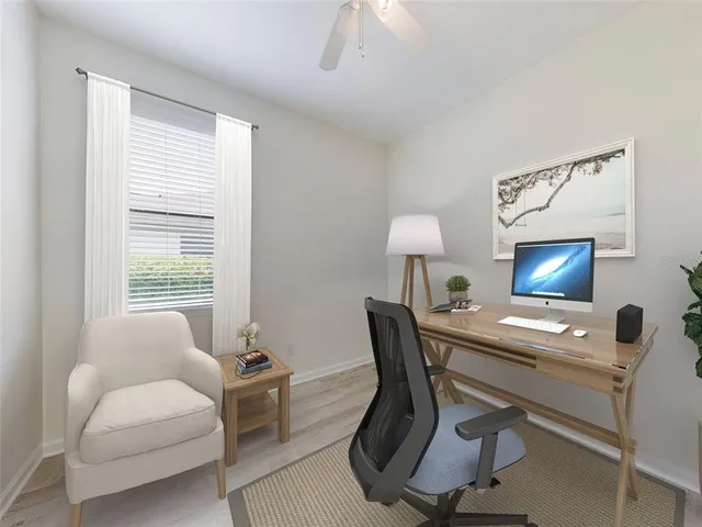 a workspace with furniture and a window