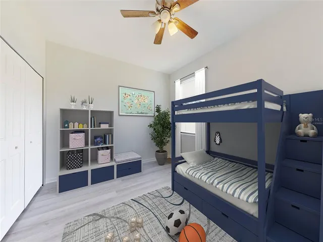 a bedroom with furniture and window