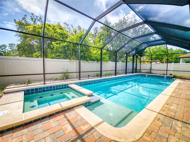 a view of a backyard with a patio