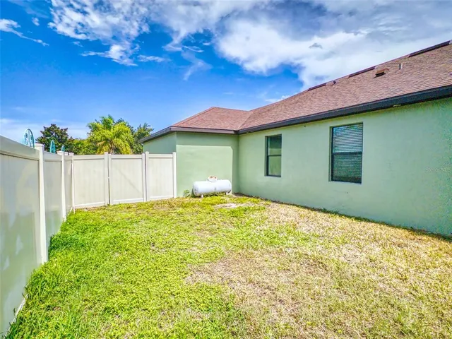 a view of a garden with a swimming pool