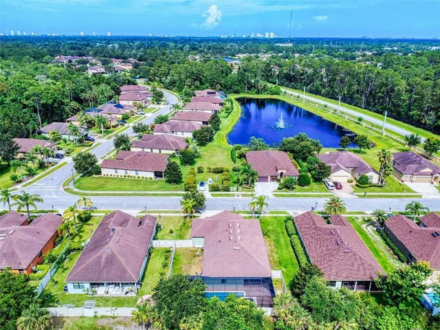 a aerial view of a house with a yard