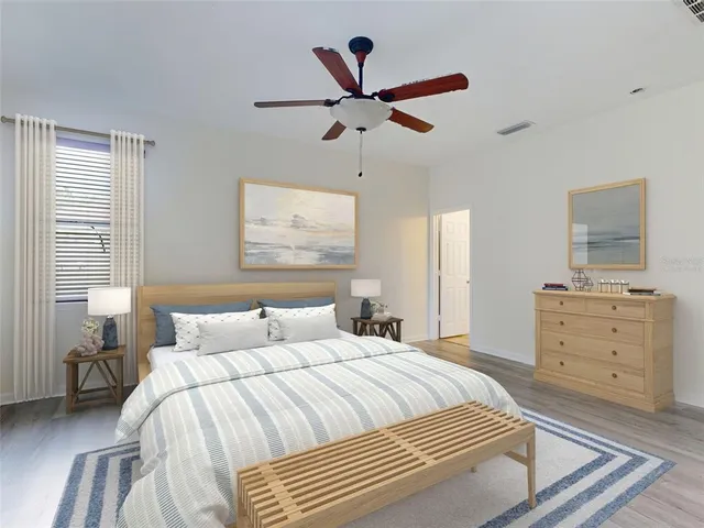 a bedroom with a bed and window