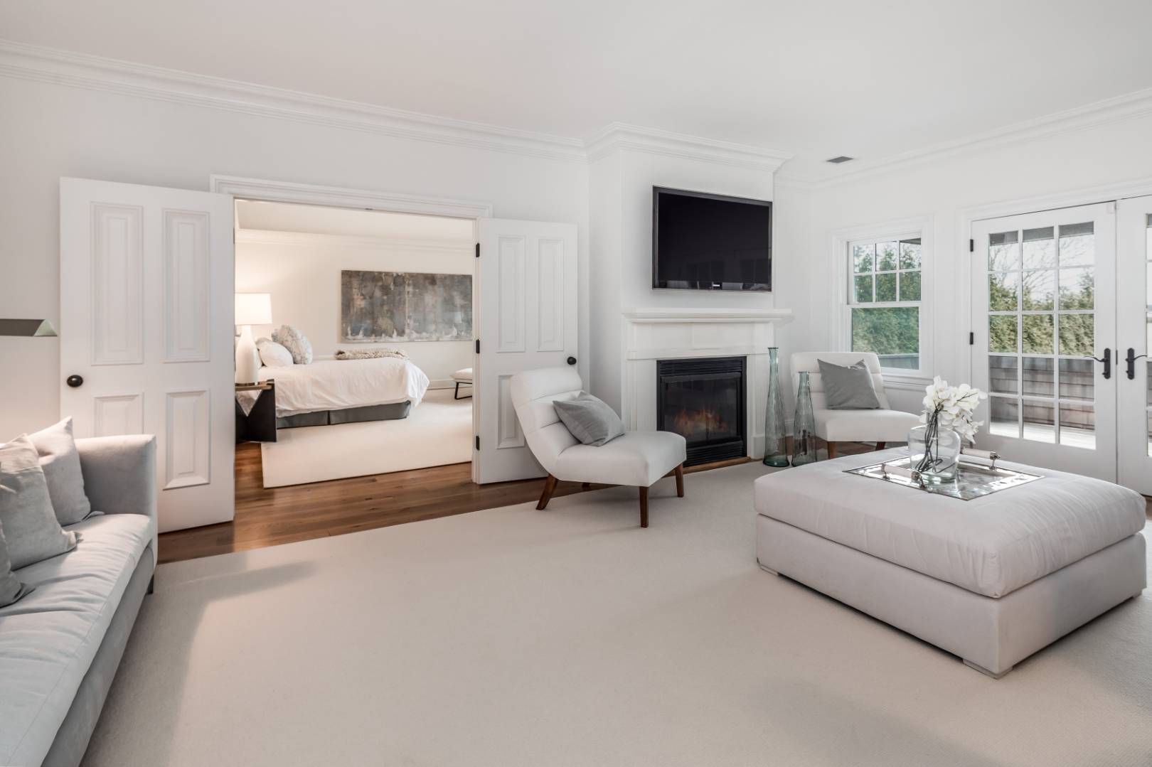 933 Cobb Road West Water Mill, NY 11976 - Photo 17 of 26 a living room with furniture a fireplace and a flat screen tv