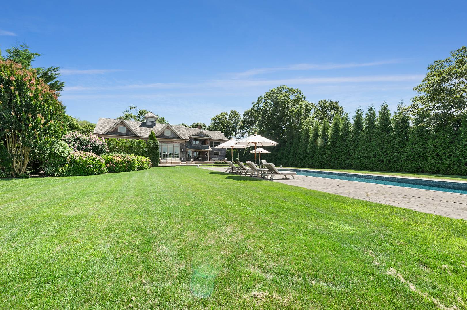 933 Cobb Road West Water Mill, NY 11976 - Photo 3 of 26 a view of a garden with lawn chairs
