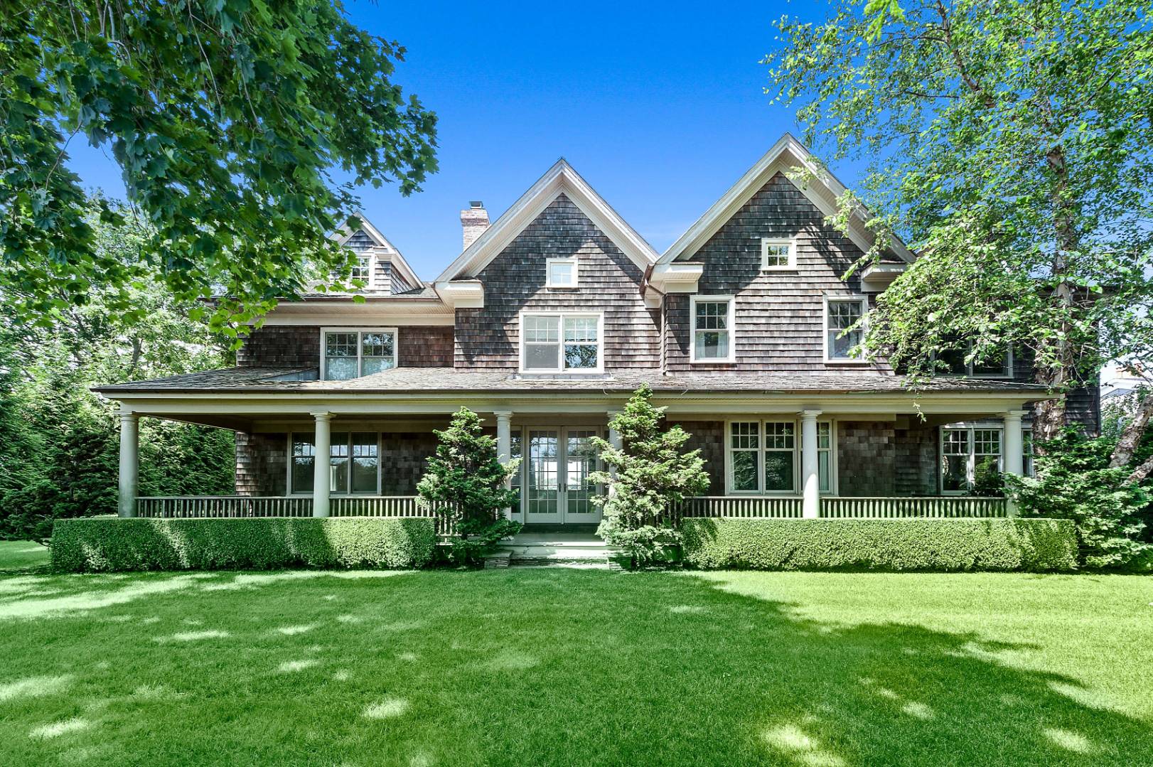 933 Cobb Road West Water Mill, NY 11976 - Photo 5 of 26 a front view of a house with a yard