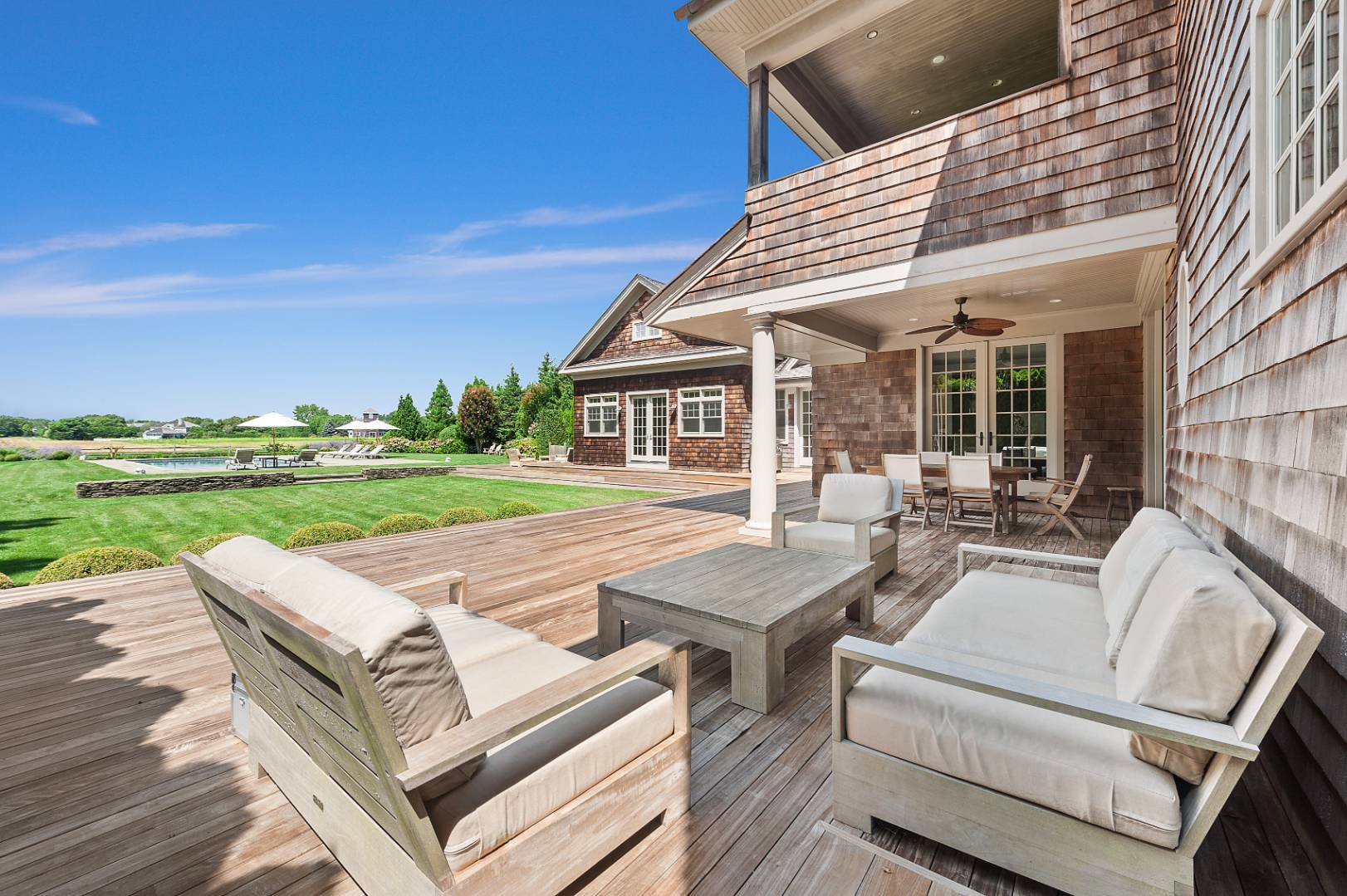 933 Cobb Road West Water Mill, NY 11976 - Photo 6 of 26 a view of a patio with couches and table with garden view
