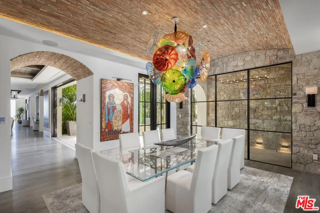 a dining room with furniture and chandelier