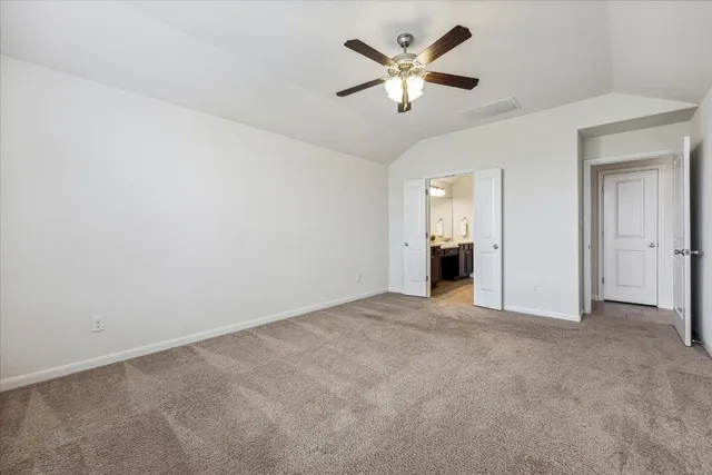an empty room with a view of a bathroom