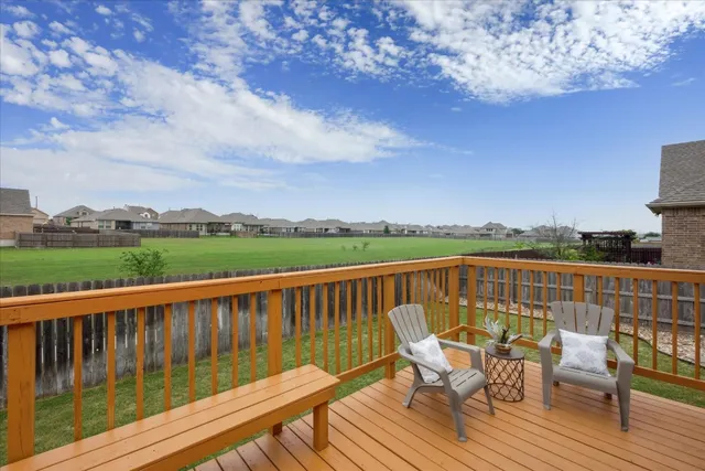 a view of a chairs on a deck