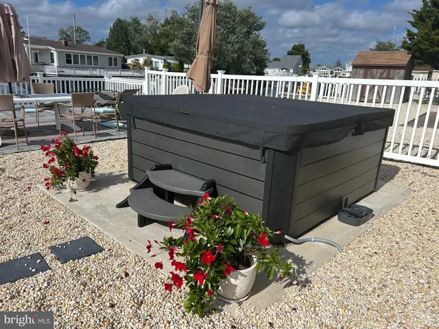 a view of a patio with a bench