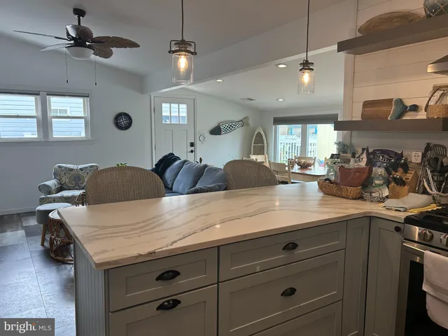 a view of a kitchen counter space a sink and appliances