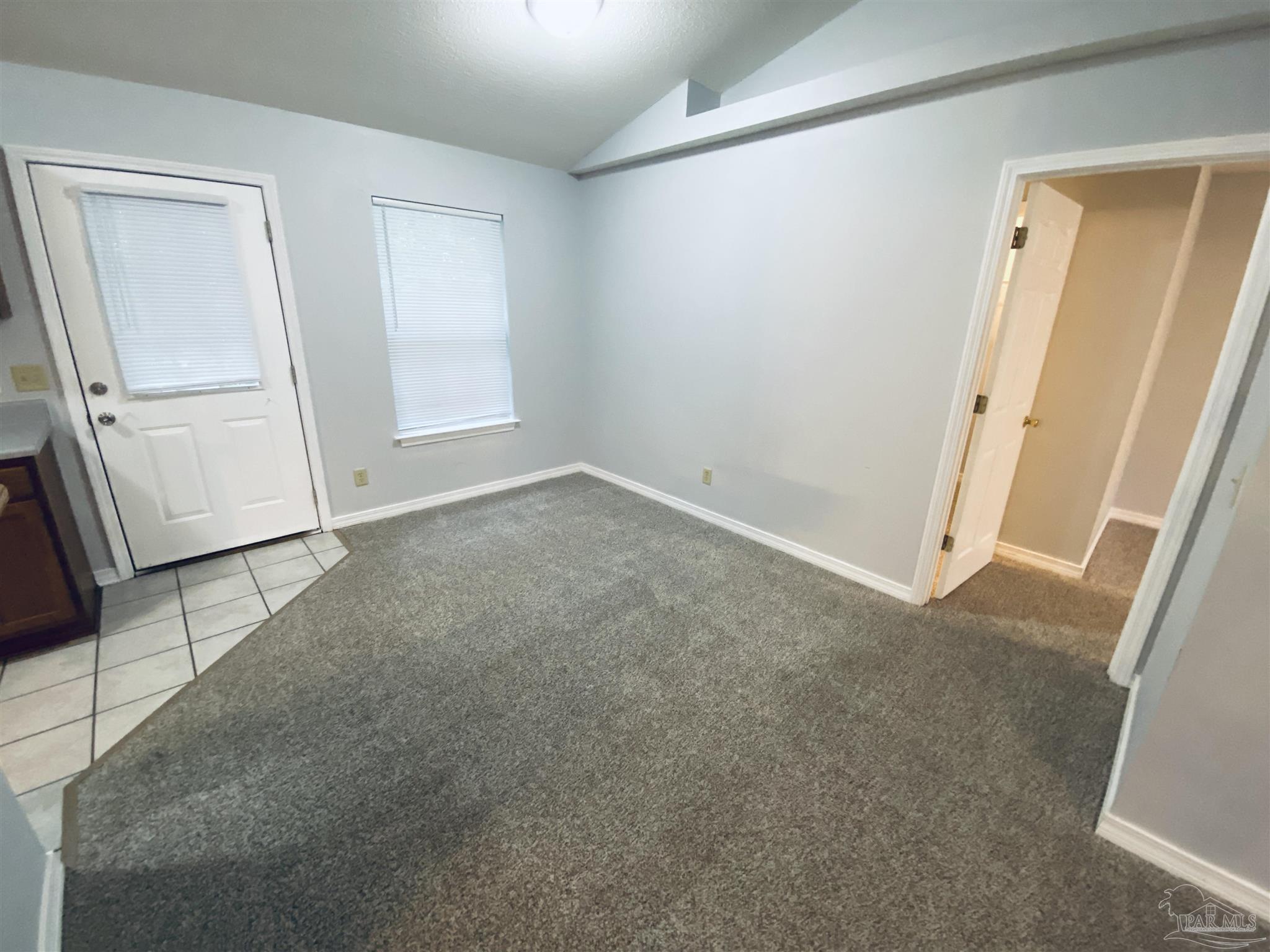 1000 Sable Drive, Unit B Pensacola, FL 32514 - Photo 9 of 10 an empty room with windows