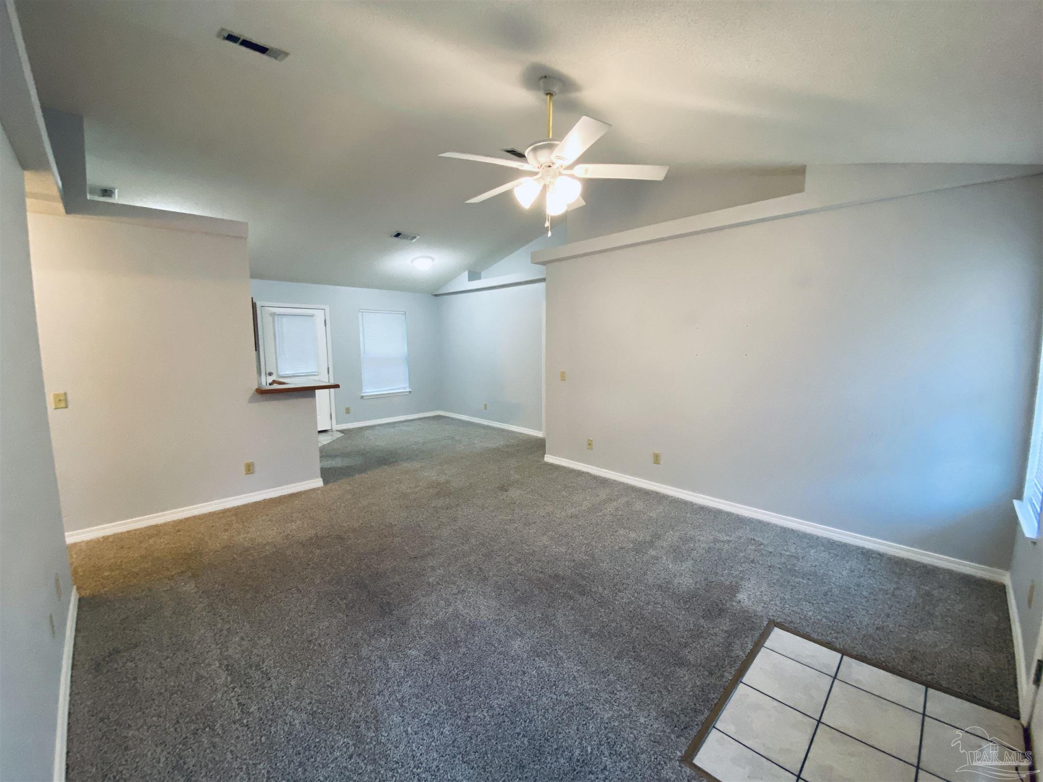 1000 Sable Drive, Unit B Pensacola, FL 32514 - Photo 10 of 10 an empty room with a ceiling fan and a window
