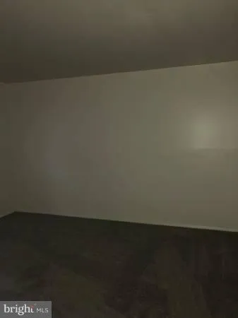 a view of room with a floor to ceiling window