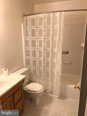 a bathroom with a toilet a sink and a shower