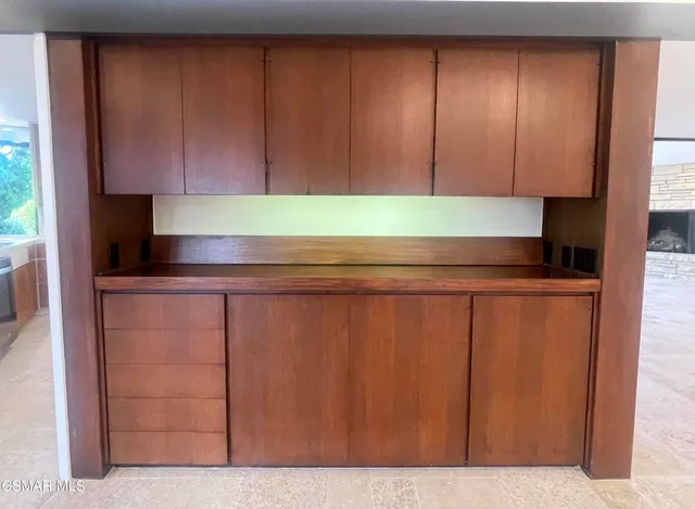 a view of an empty room with a large window