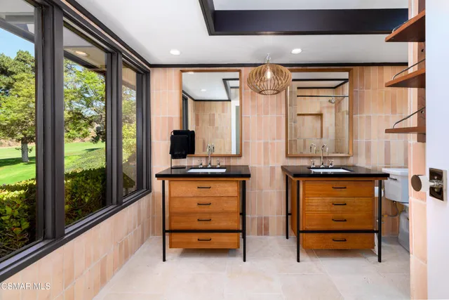 a view of a golf course with a lake view