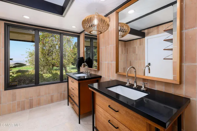 a view of a golf course with a lake view