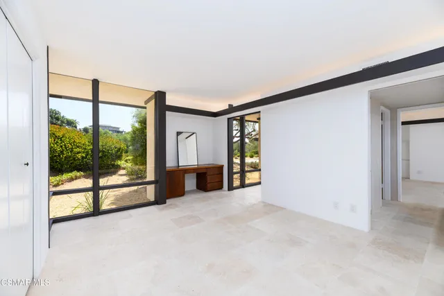 an aerial view of residential houses with outdoor space and river