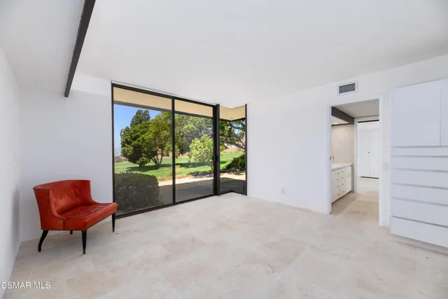 a view of a swimming pool and an outdoor space