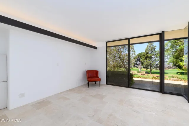 an aerial view of a house with a yard basket ball court and outdoor seating