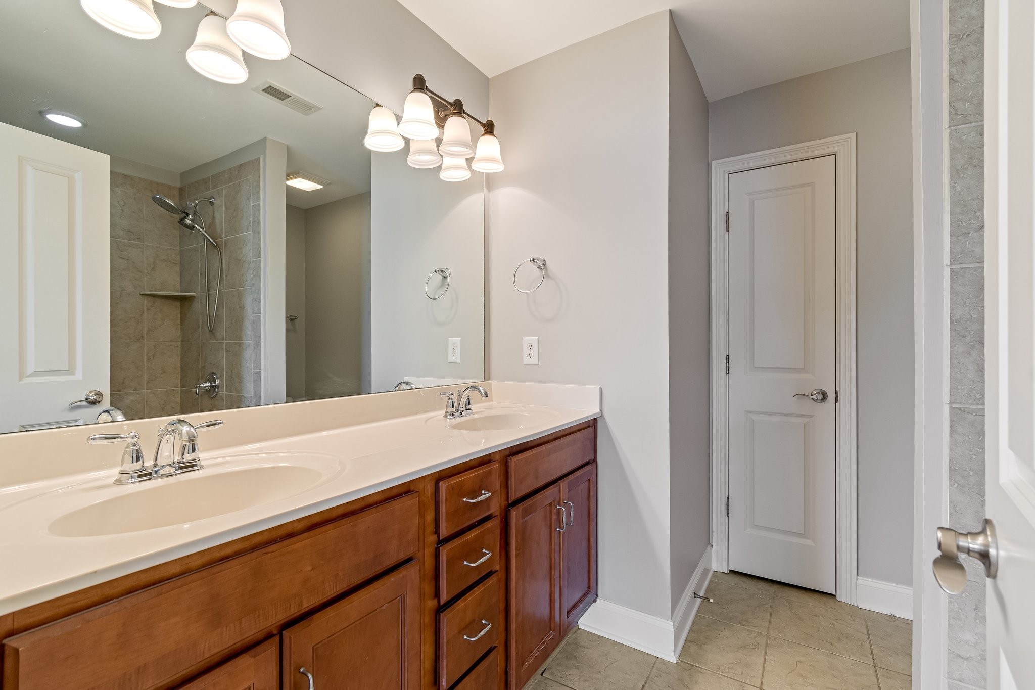 318 Byron Way Franklin, TN 37064 - Photo 36 of 53 a bathroom with a double vanity sink and a mirror