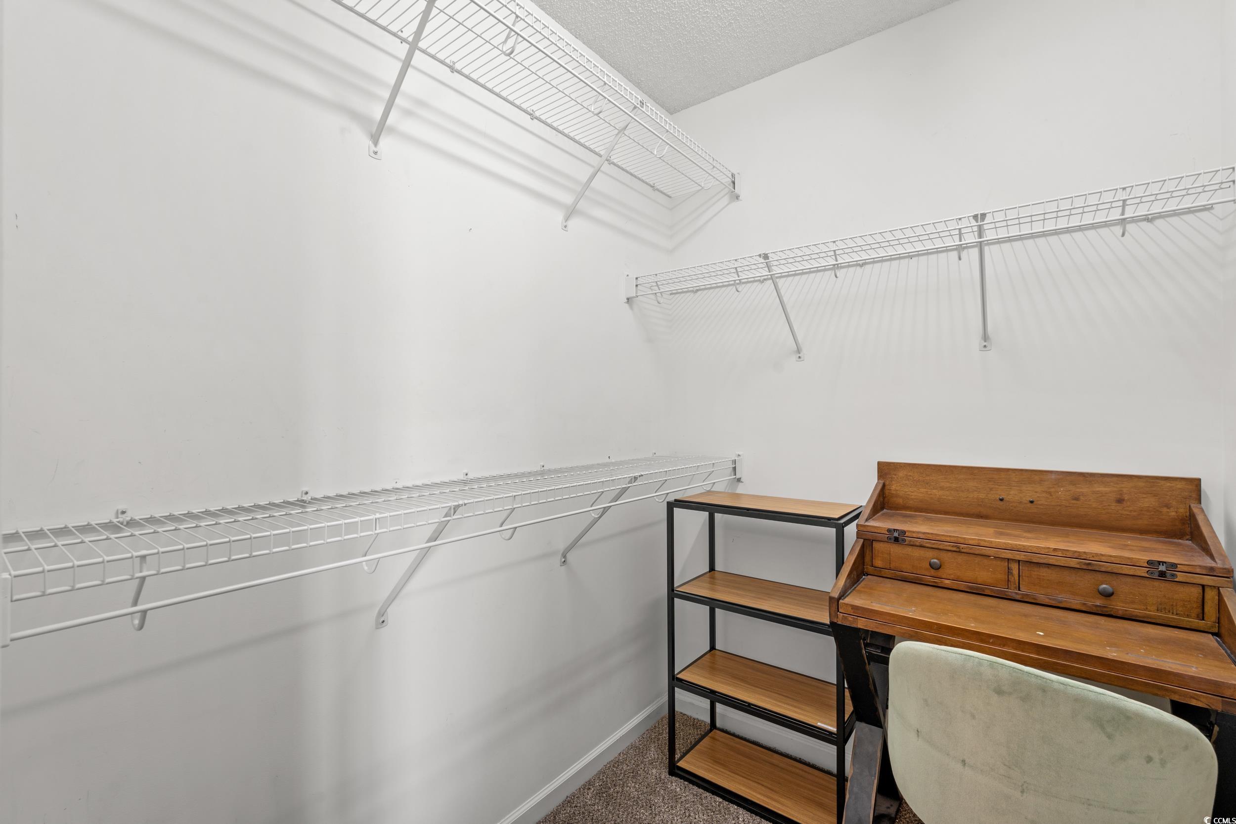 270 Seabert Road, Unit 270 Myrtle Beach, SC 29579 - Photo 15 of 31 Full bathroom featuring a shower with curtain, dark tile patterned floors, and vanity