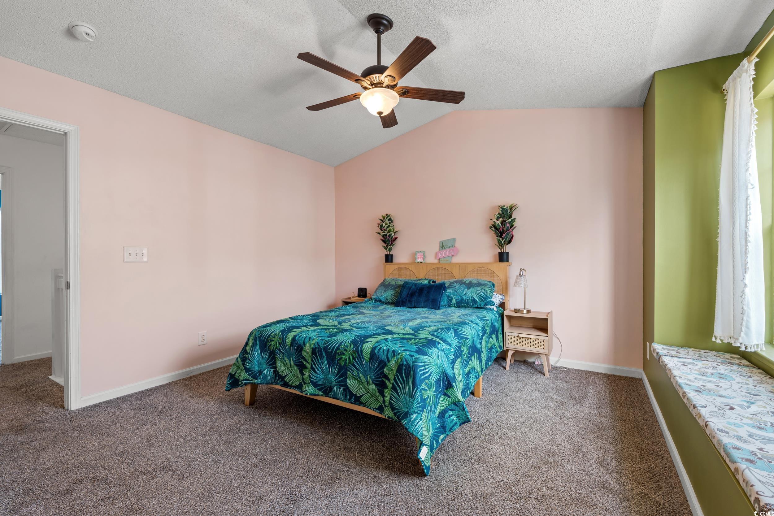 270 Seabert Road, Unit 270 Myrtle Beach, SC 29579 - Photo 17 of 31 Rear view of property featuring a lawn and a patio