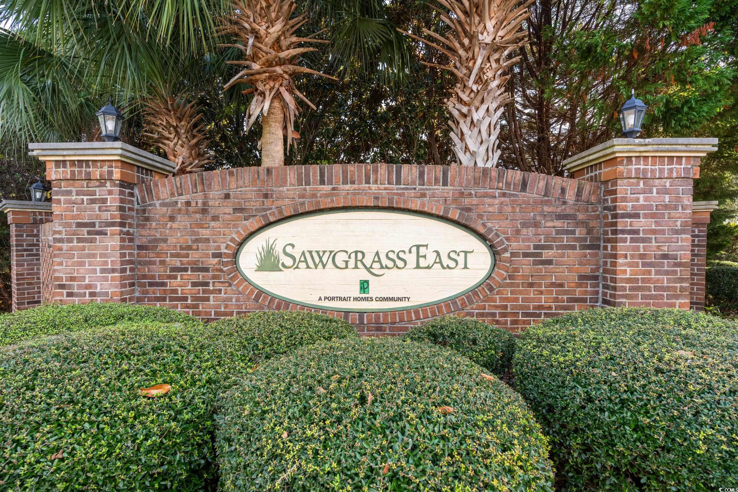 270 Seabert Road, Unit 270 Myrtle Beach, SC 29579 - Photo 21 of 31 Doorway to property featuring brick siding and covered porch