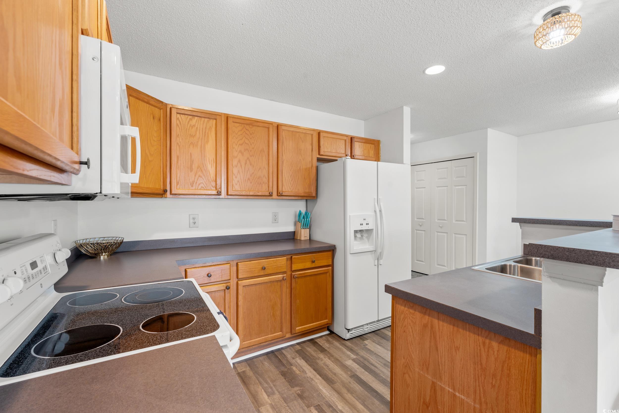 270 Seabert Road, Unit 270 Myrtle Beach, SC 29579 - Photo 7 of 31 Dining area featuring dark carpet and a textured ceiling