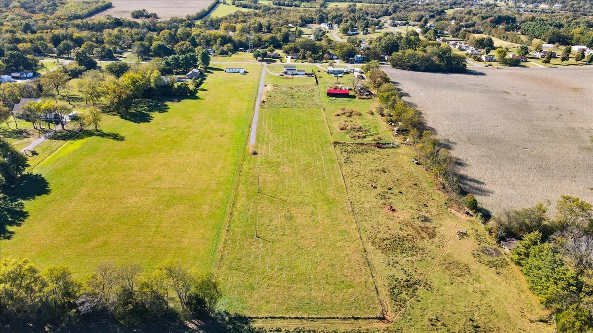 a aerial view of residential houses with swimming pool