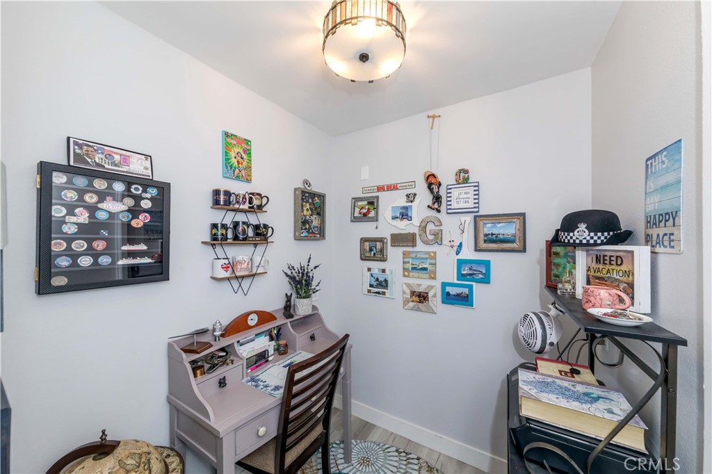12671 Briarglen Loop, Unit G Stanton, CA 90680 - Photo 17 of 24 a living room with furniture and book shelf