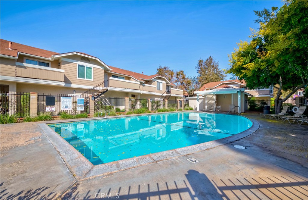 12671 Briarglen Loop, Unit G Stanton, CA 90680 - Photo 22 of 24 a front view of houses with yard