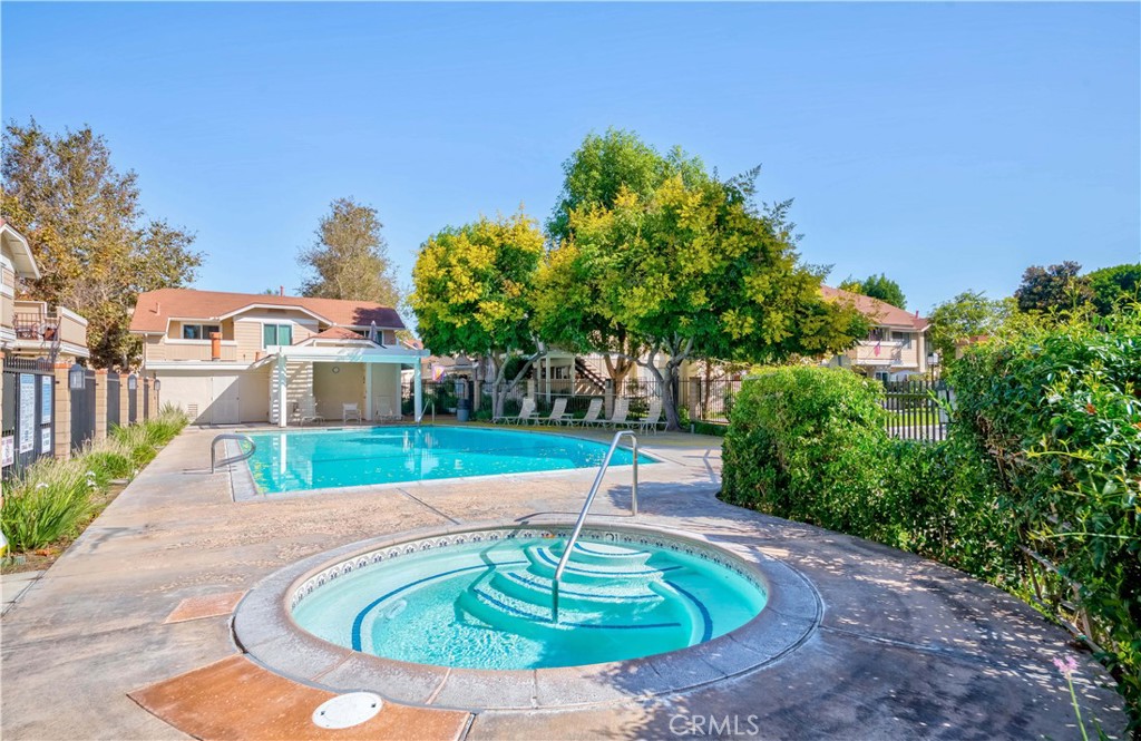 12671 Briarglen Loop, Unit G Stanton, CA 90680 - Photo 23 of 24 a house view with a swimming pool