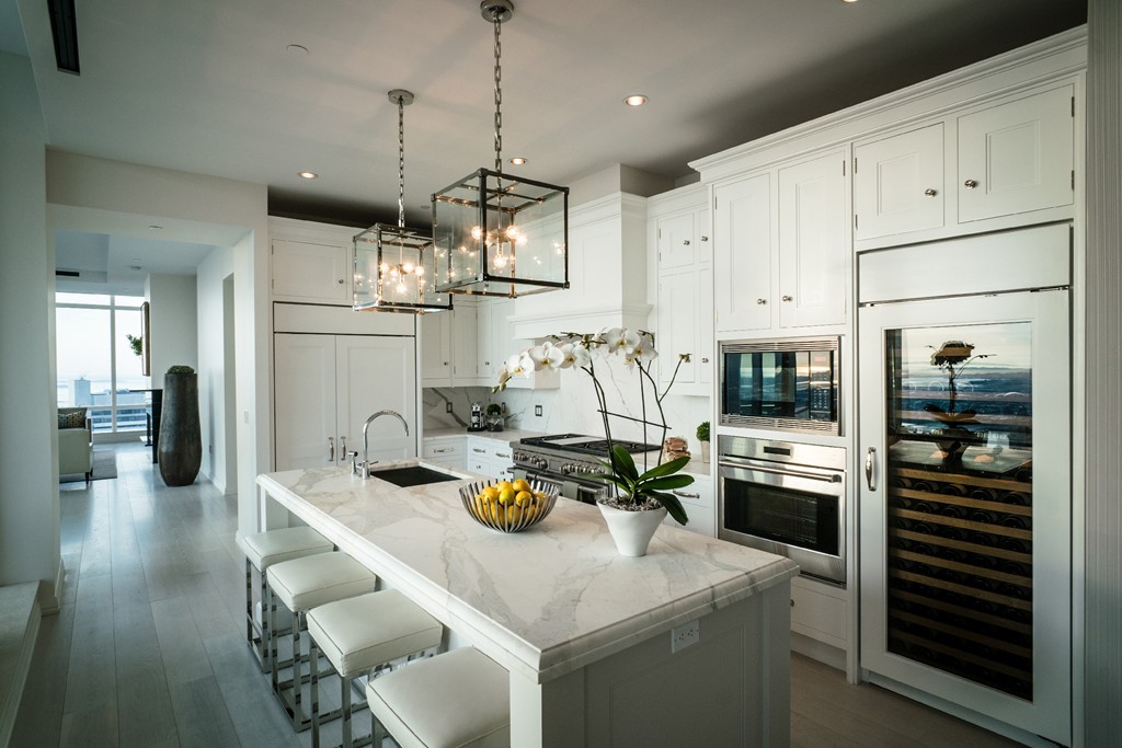 1 Franklin Street, Unit PH 2D Boston, MA 02110 - Photo 3 of 26 a kitchen with refrigerator and cabinets