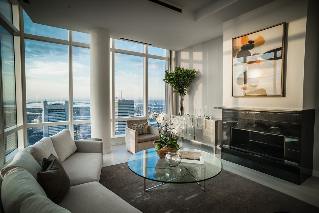1 Franklin Street, Unit PH 2D Boston, MA 02110 - Photo 5 of 26 a living room with furniture and a potted plant